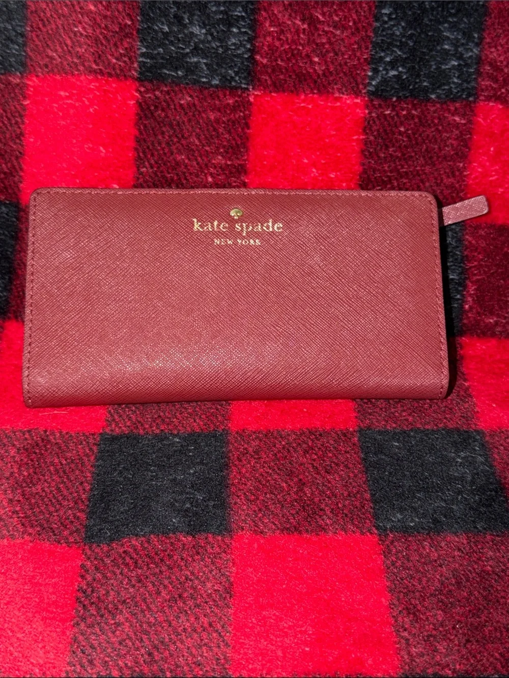 Kate Spade New York Staci large slim bifold wallet in a red currant shade